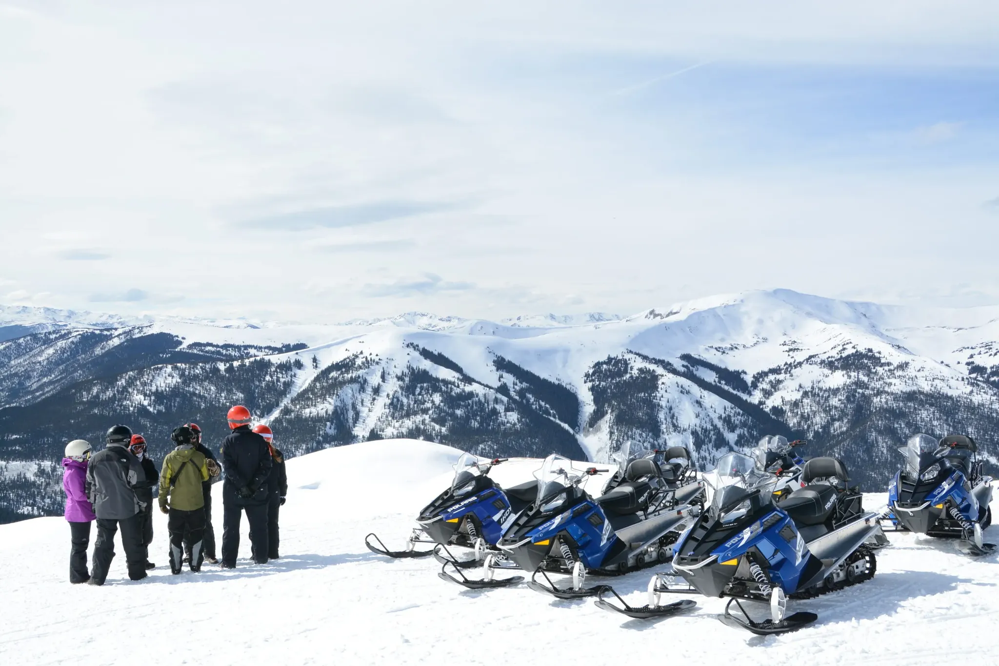 Group of snowmobilers on a guided tour near Beaver Creek Colorado