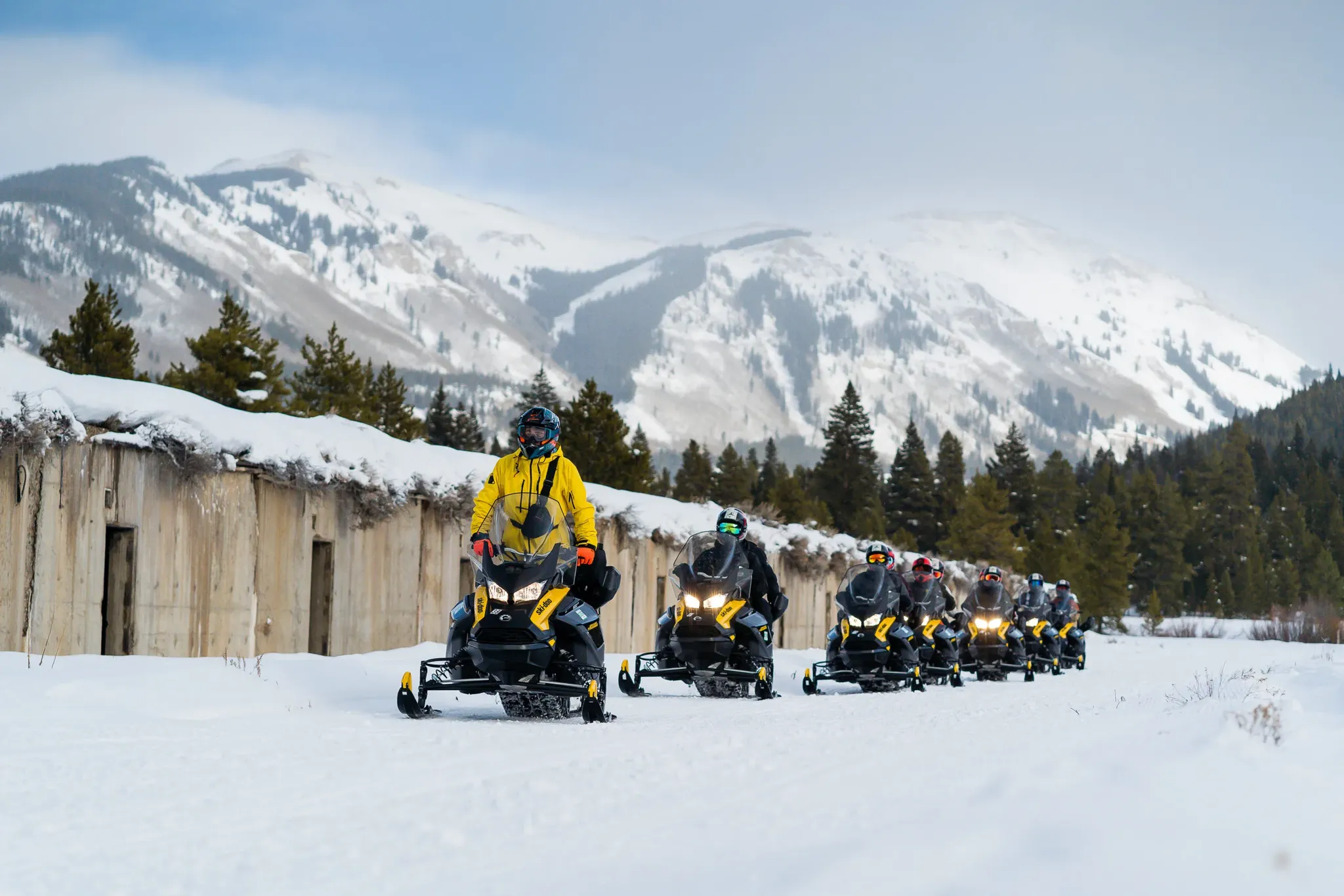 Self-guided snowmobile rental riders on groomed trails near Beaver Creek Colorado
