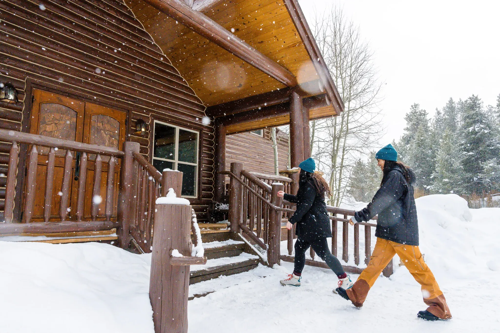 Self-guided snowmobile rental riders entering lodge near Beaver Creek, Colorado.